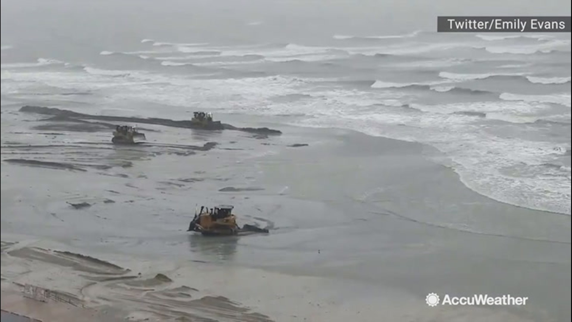 As Tropical Storm Imelda devastated Freeport, Texas, with powerful rain on Sept. 18, beach workers did what they could to keep the beach built up by moving sand from the gulf onto the beach.