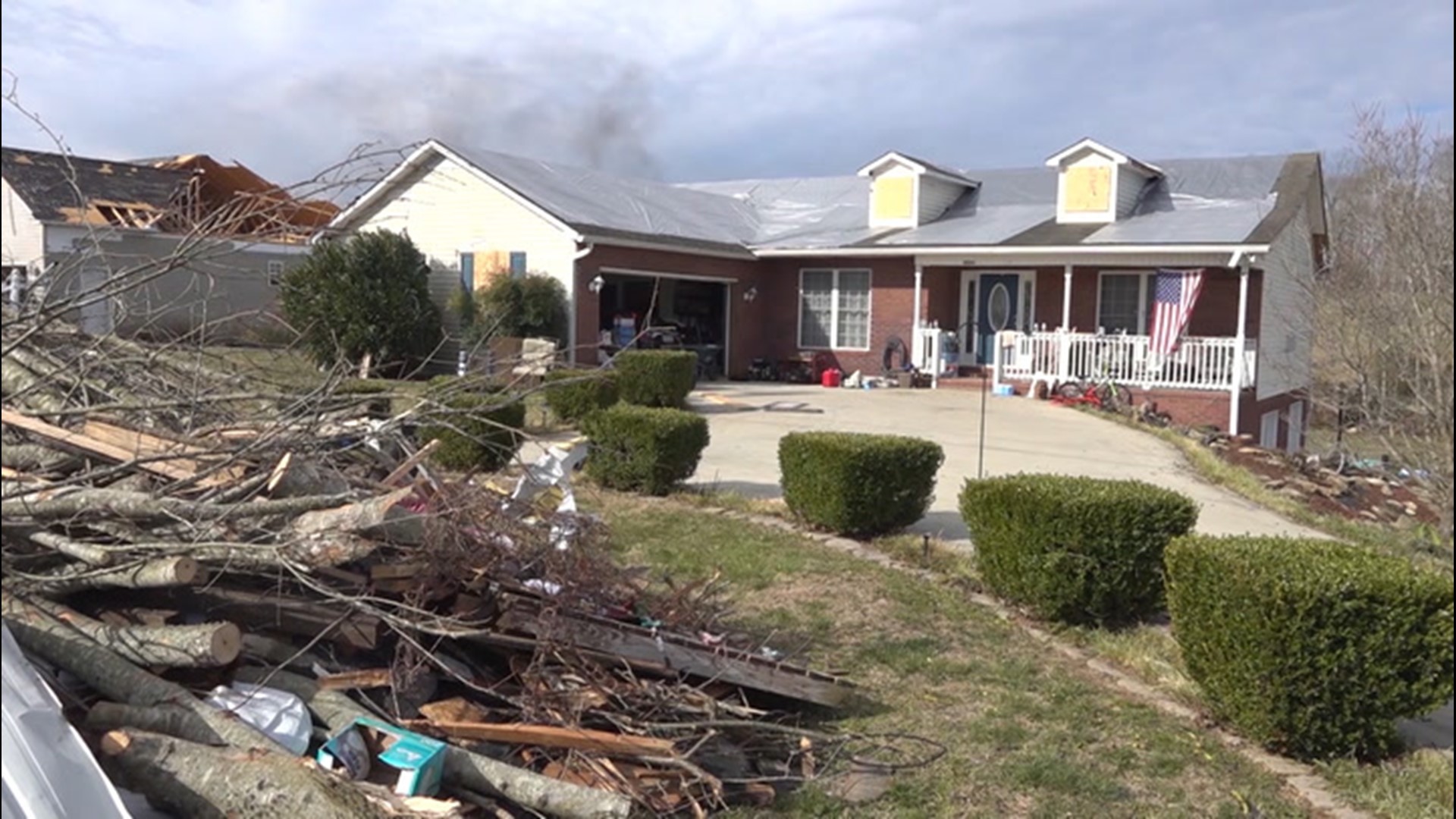 A nurse who helped her injured neighbors after a violent tornado in Tennessee last March said the families are much closer while working to rebuild their homes.