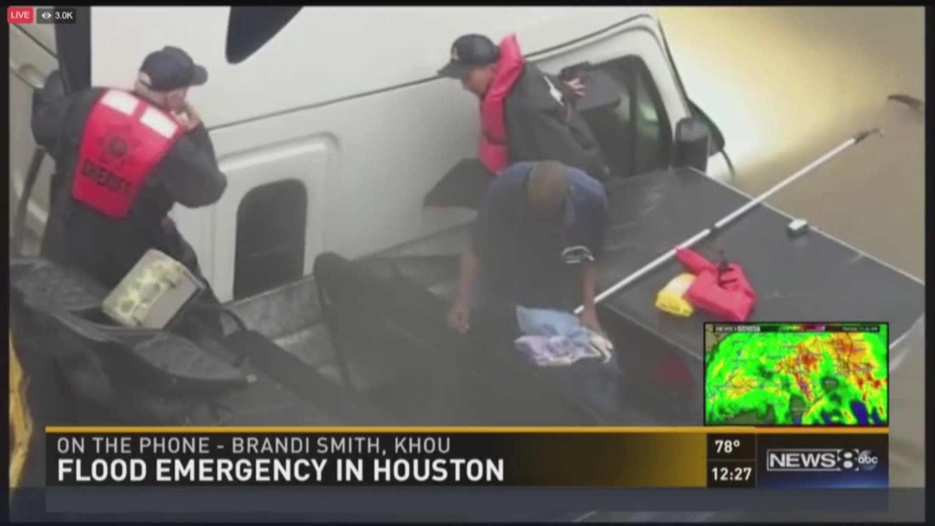 KHOU reporter Brandi Smith saw a man trapped in his flooded truck, and was able to flag down the police, who later rescued him.