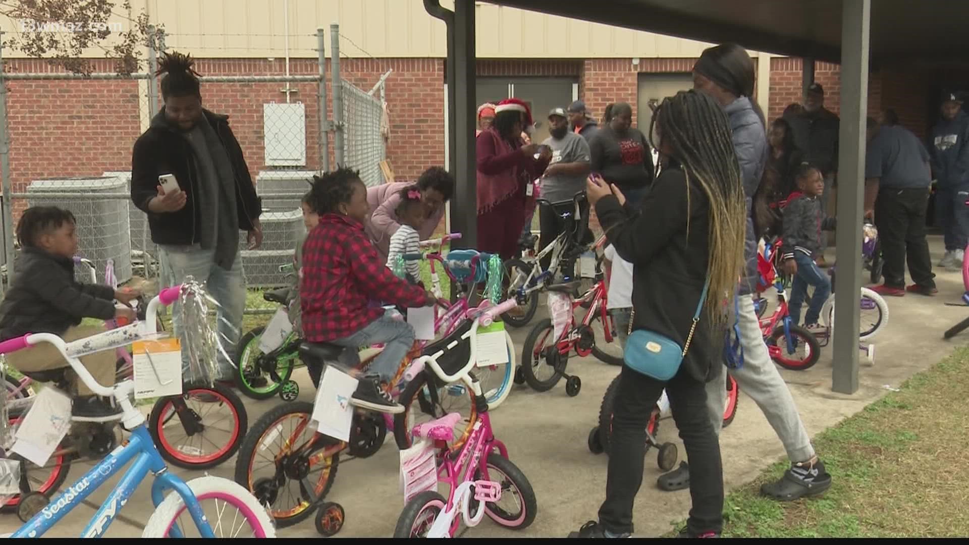 A Macon group gave away 50 bicycles to kids who achieved excellence in reading. Children were jumping with excitement with their parents there to capture the moment