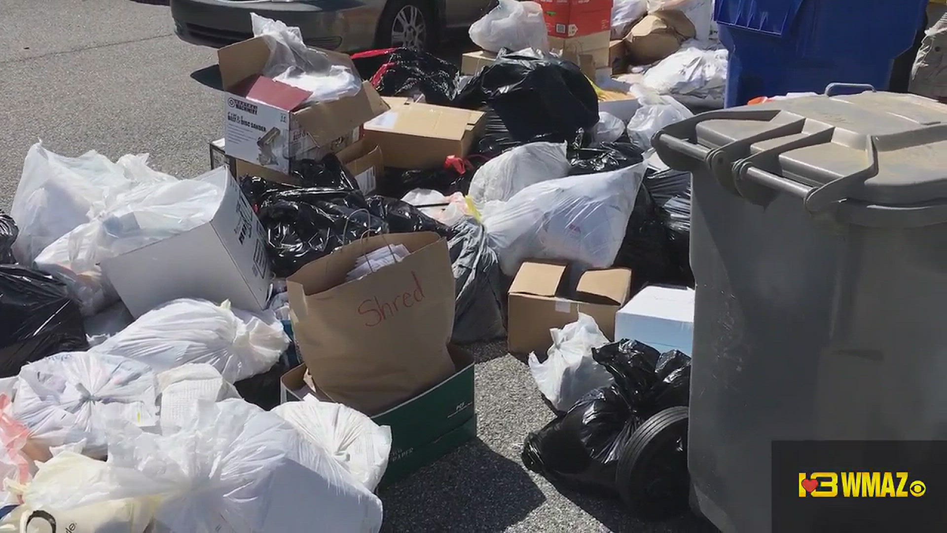 Brisk business as folks drop off old papers and documents for shredding at BBB Shred Day at Walmart on Zebulon Road