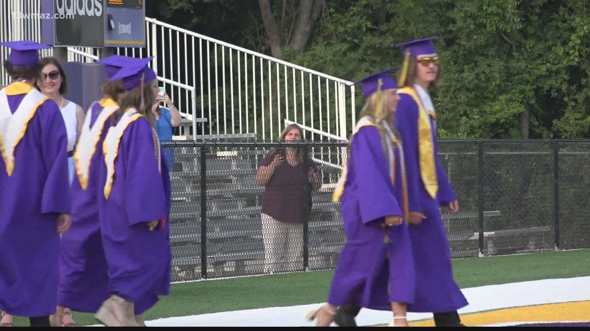 Central Georgia students and families are facing the heat at outdoor graduations this week. Here's how schools are working to keep people cool.