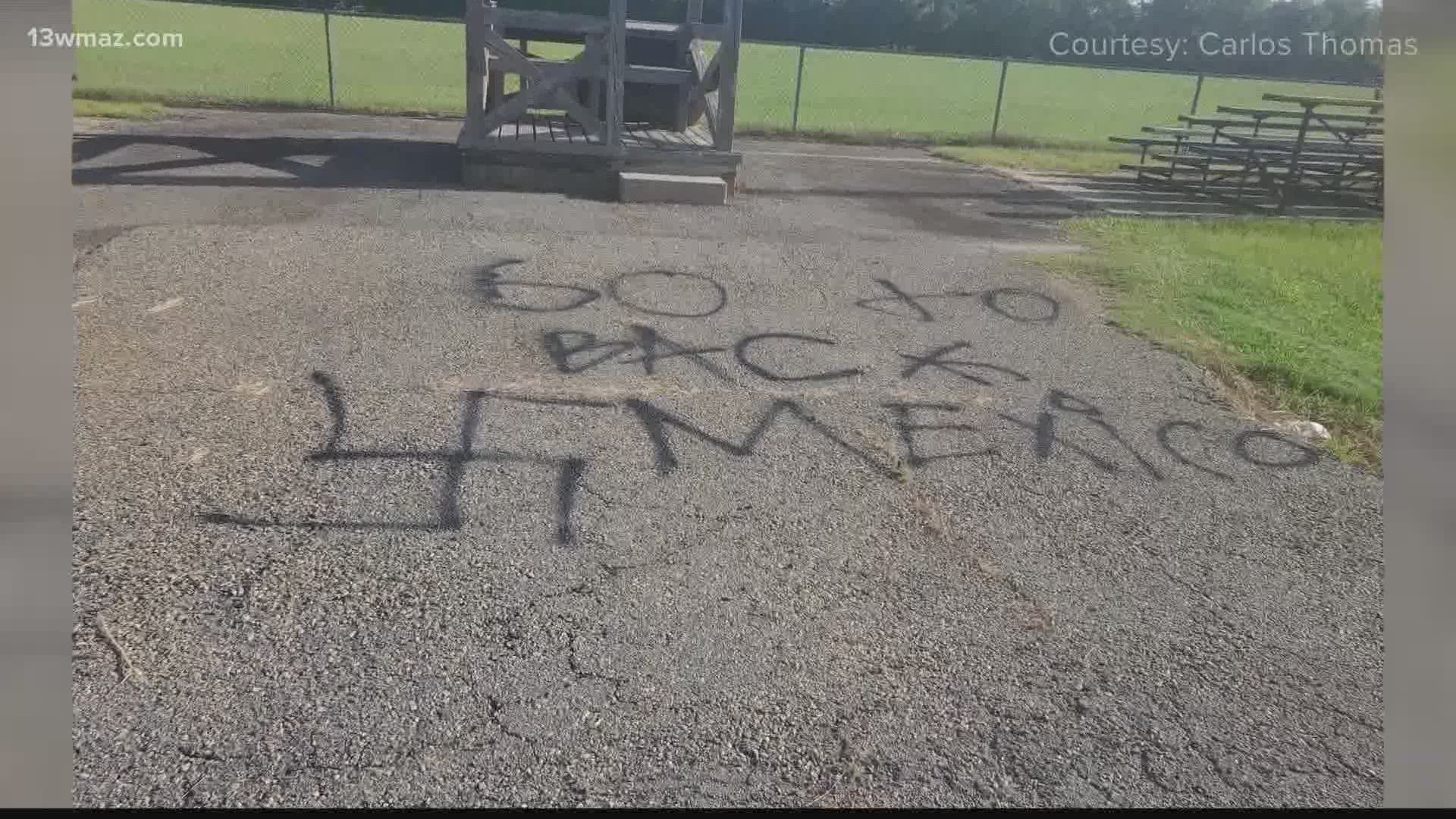 In Peach County, a dozen people came together to clean up hateful words and symbols at a public park.