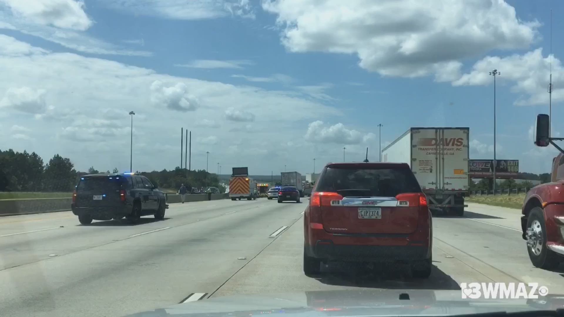 According to Georgia 511, a wreck involving two cars and one truck is blocking the three left lanes on I-75 South near Hartley Bridge Road
