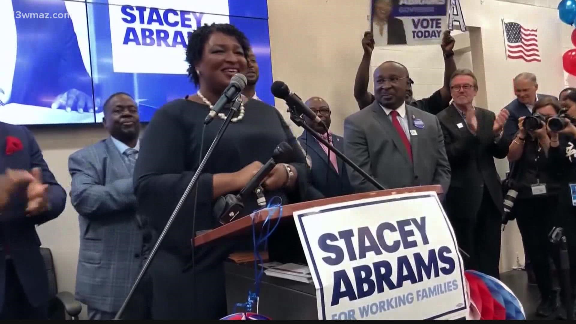 How did Stacey Abrams help relieve debt for thousands of Georgians?