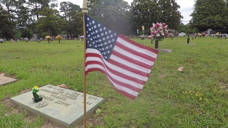 Organizations gather to place flags on veterans graves at Magnolia Park Cemetery