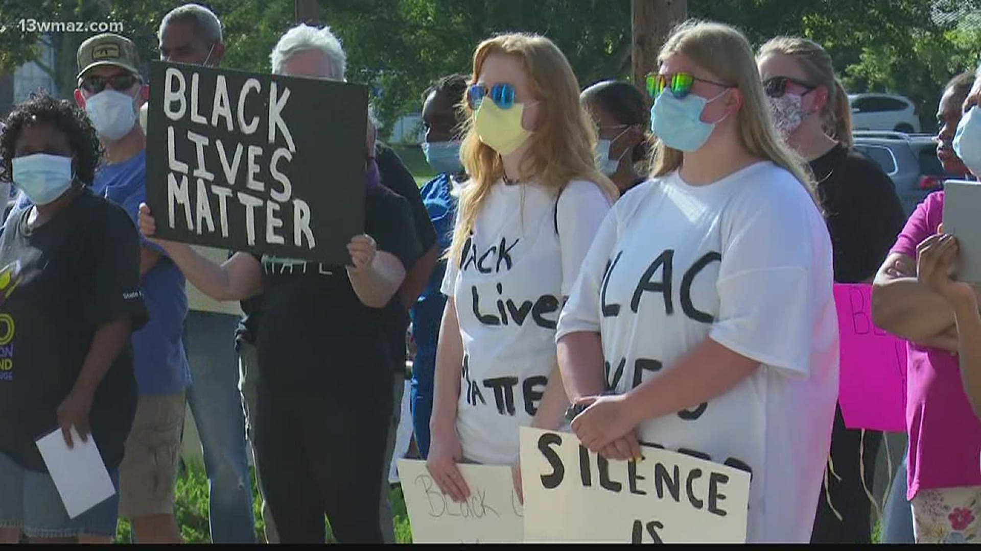 People from around the Hawkinsville community gathered in front of the courthouse to express their concerns and hope for change.