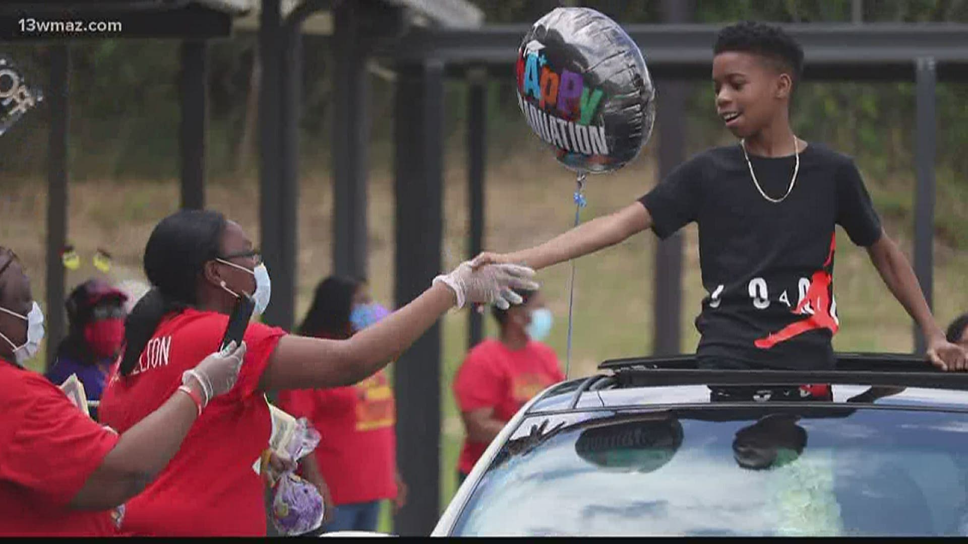 Staff at Hartley Elementary School held a drive-thru graduation ceremony for their fifth-graders Tuesday.