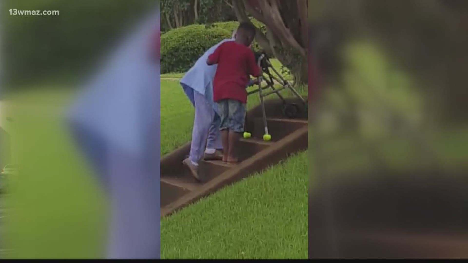 Video of Milledgeville boy helping elderly woman up stairs goes viral