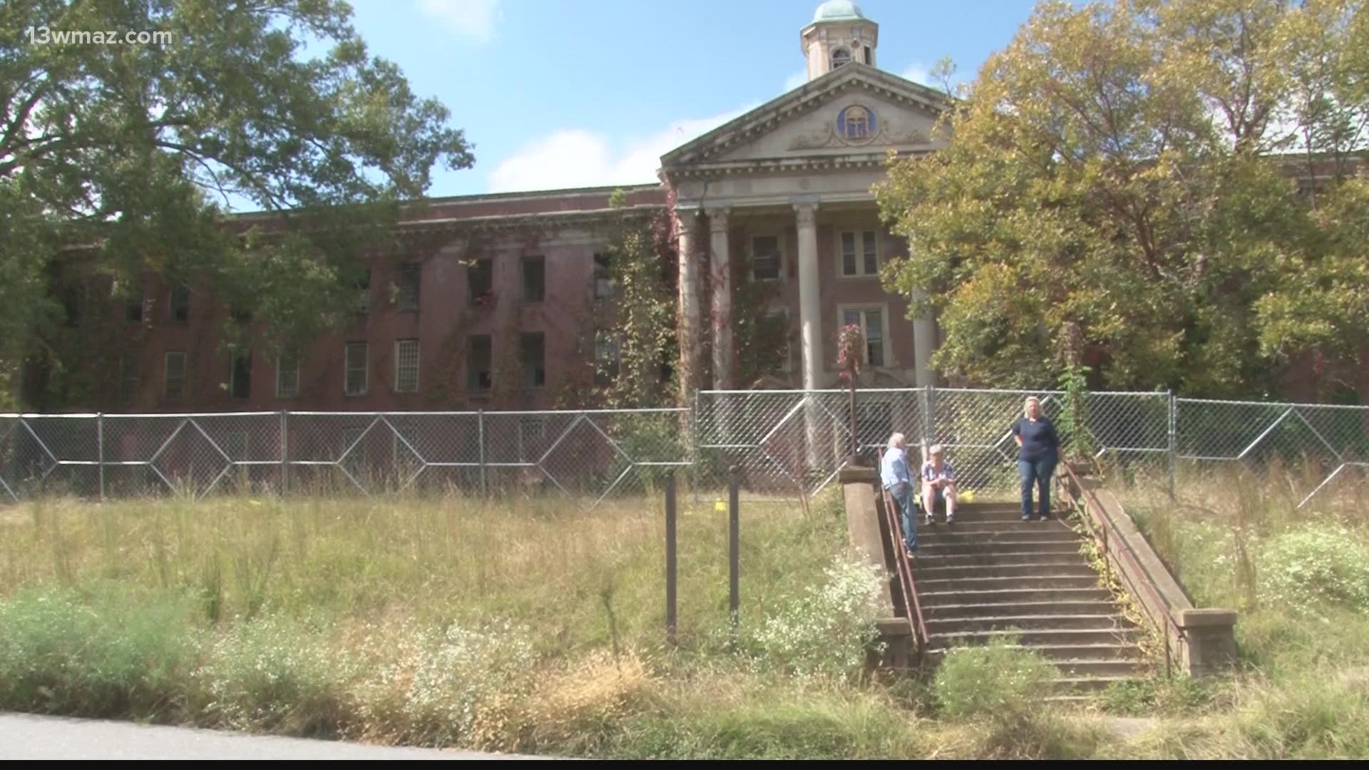 A state agency has installed fences around several buildings on Central State's campus to remove asbestos, but folks are concerned it's a sign for something bigger.