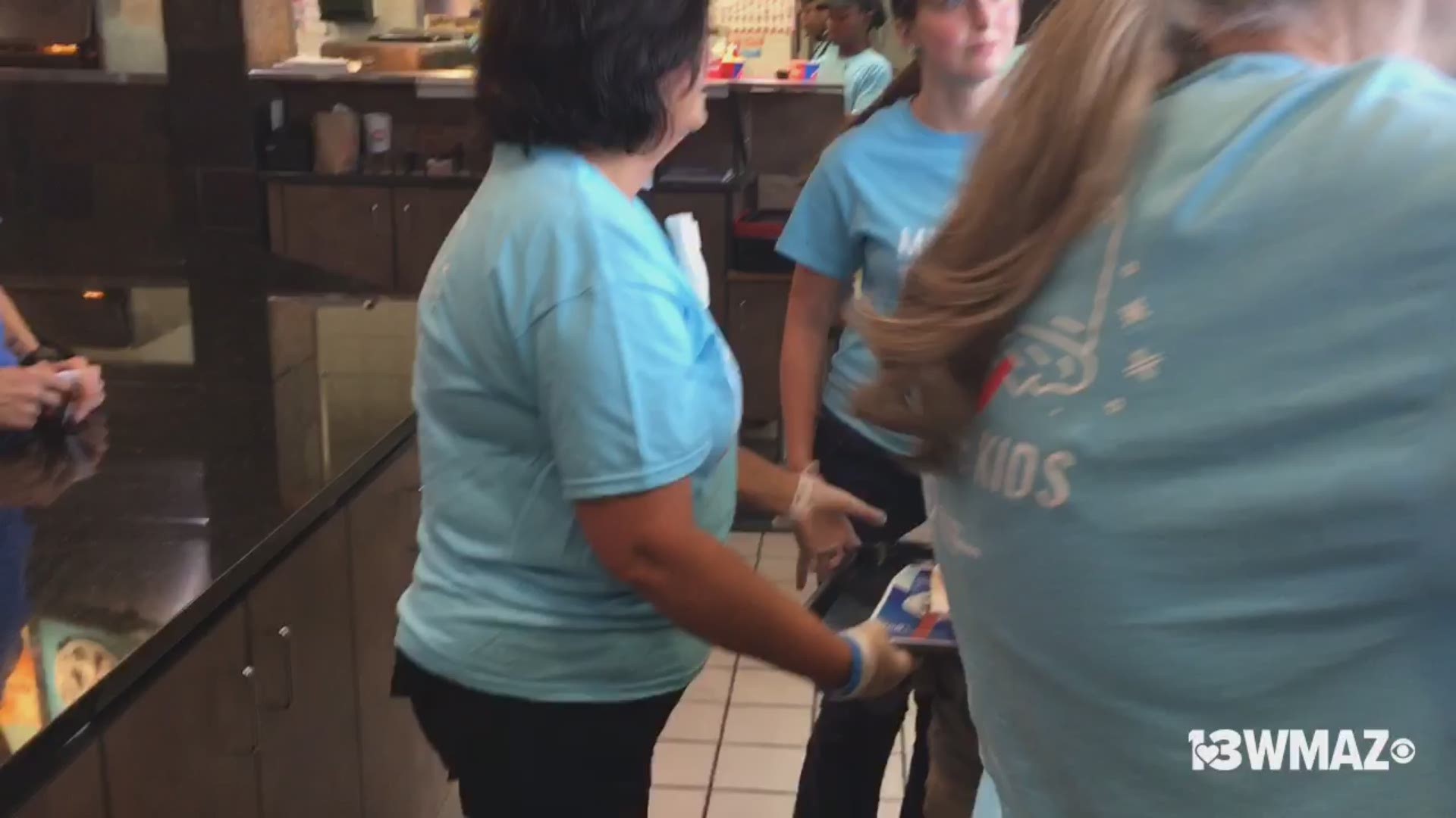 Everyone's working hard at Dairy Queen in Forsyth for Miracle Treat Day to benefit Beverly Knight Olsen Children's Hospital. Watch Charlee serve up food.