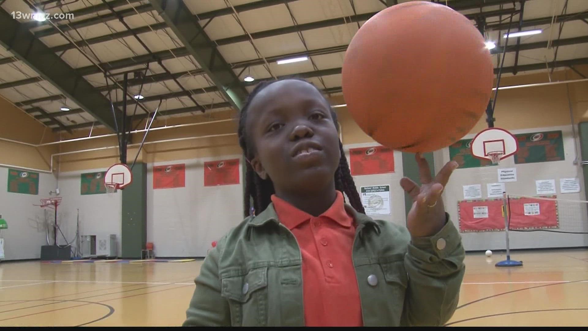 As a sixth-grader at Rutland Middle School in Macon, it's Tabrayah Woodard's first year playing organized ball on a team, and she's loving every minute of it