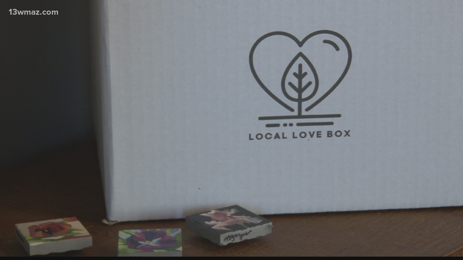 The quarterly Local Love Boxes will be filled with items from across central Georgia. The first one has a shirt candles, hand-painted tile magnets, and more.