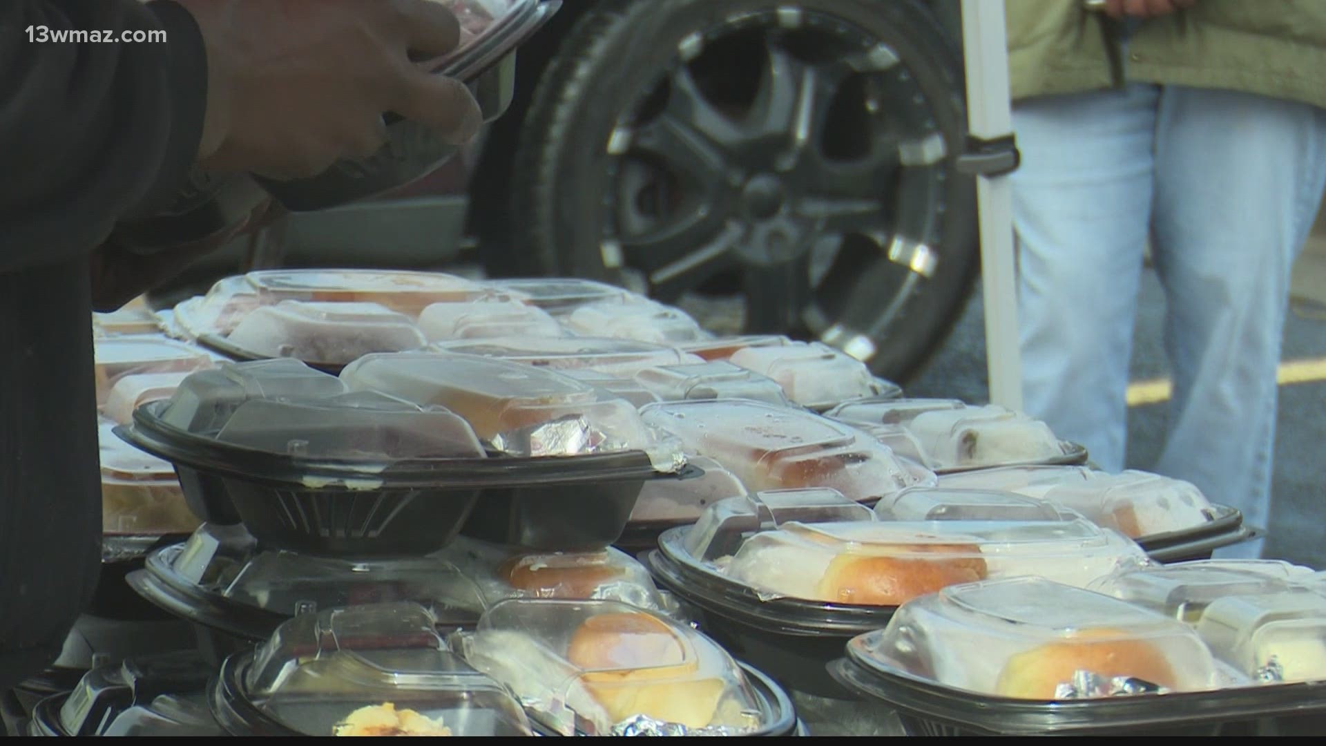 A Macon law firm spent their Thanksgiving morning handing out hot meals to those in need.