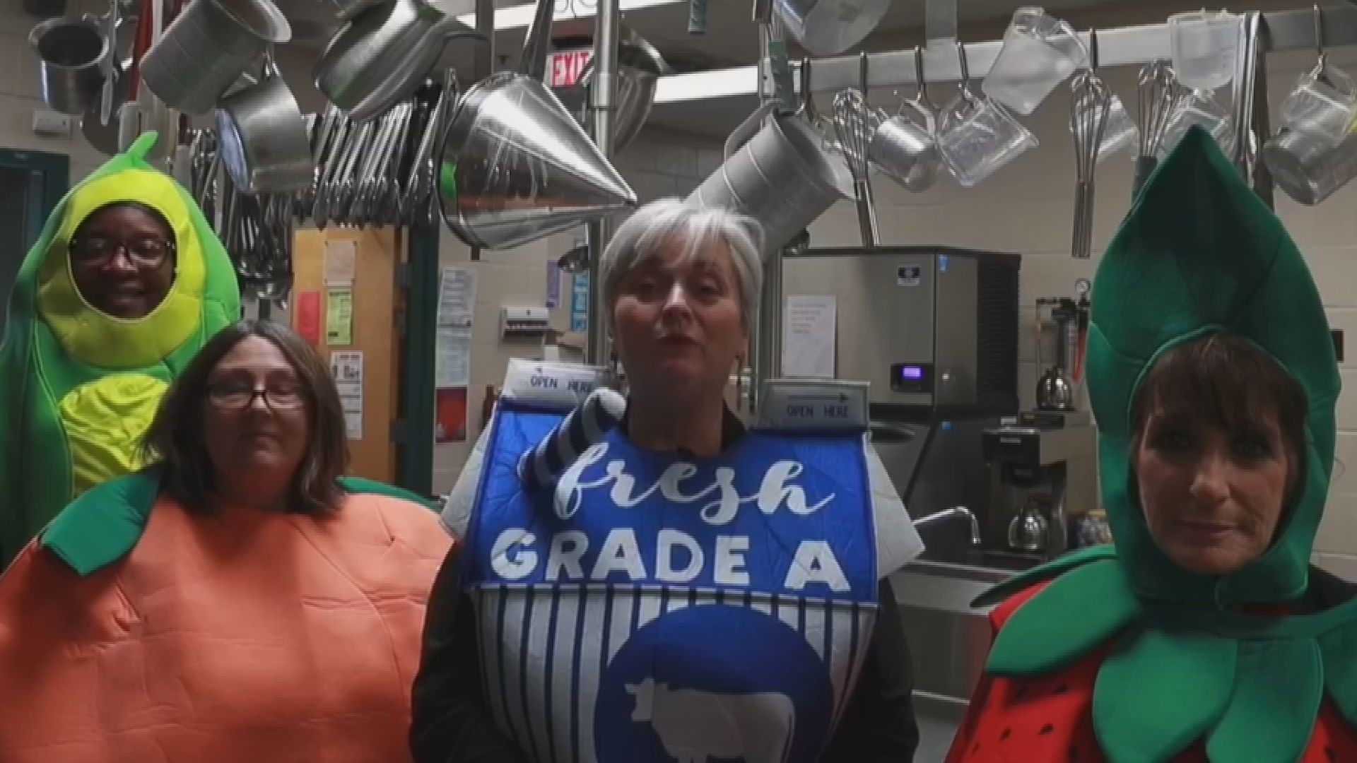 Cafeteria staff dressed up as fruits and vegetables for videos aimed at encouraging kids to read