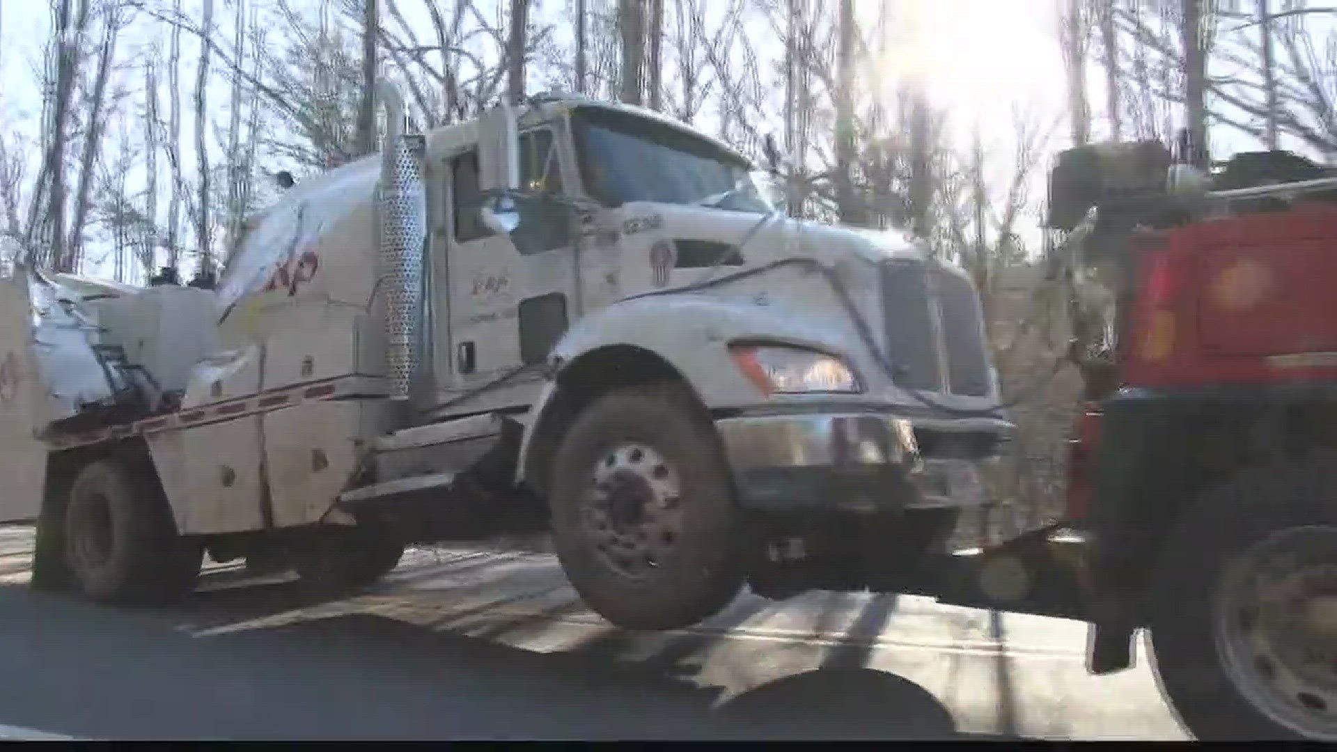 Fuel tanker truck overturns in Monroe County