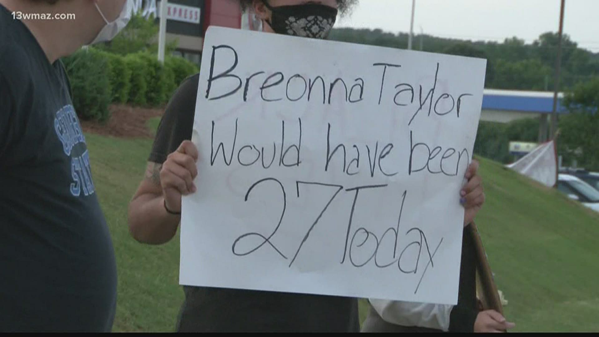 A Macon man and other protesters held signs near a busy road to bring awareness about Breonna Taylor on her birthday, as well other victims who have died.