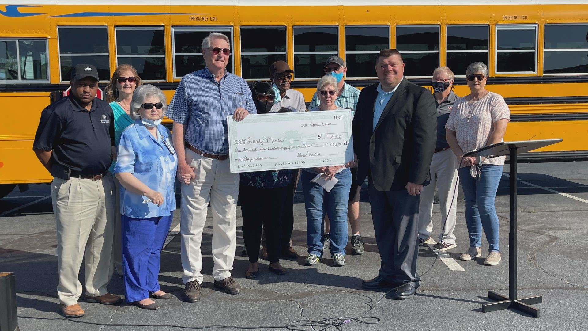School bus drivers gave some of their bonus money to their former colleague Grady Mimbs to show their appreciation for his morning devotions.