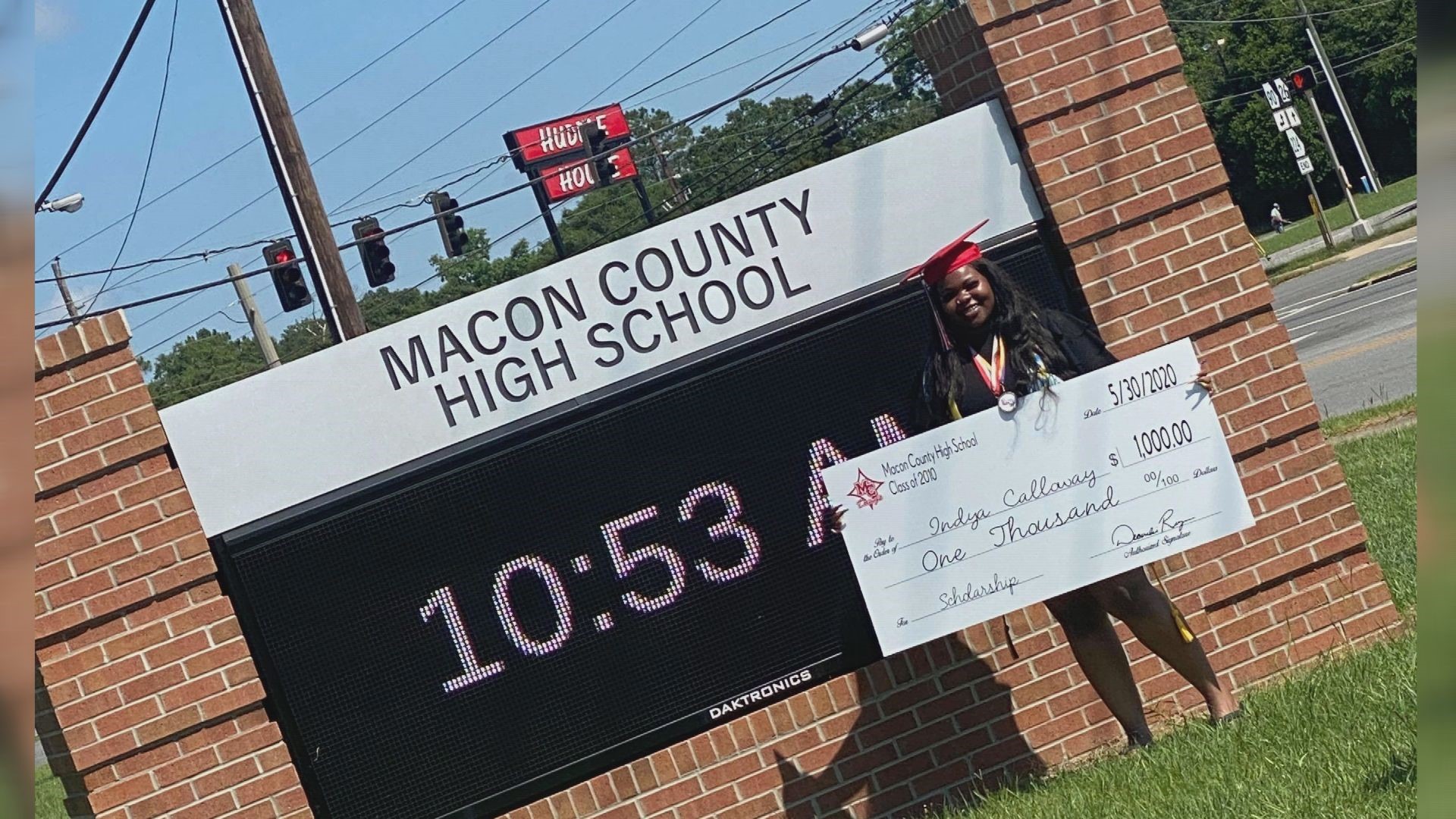 Former students raised enough money to give Indya Calloway a $1,000 check for college.