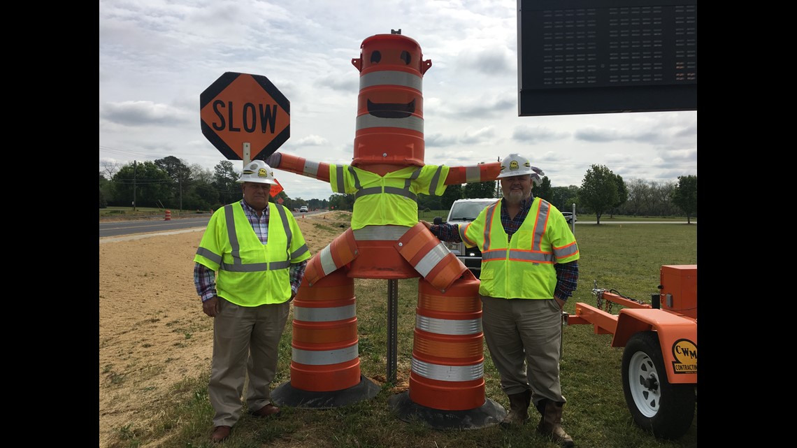 Company builds "Barrel Man" using construction barrels to promote work