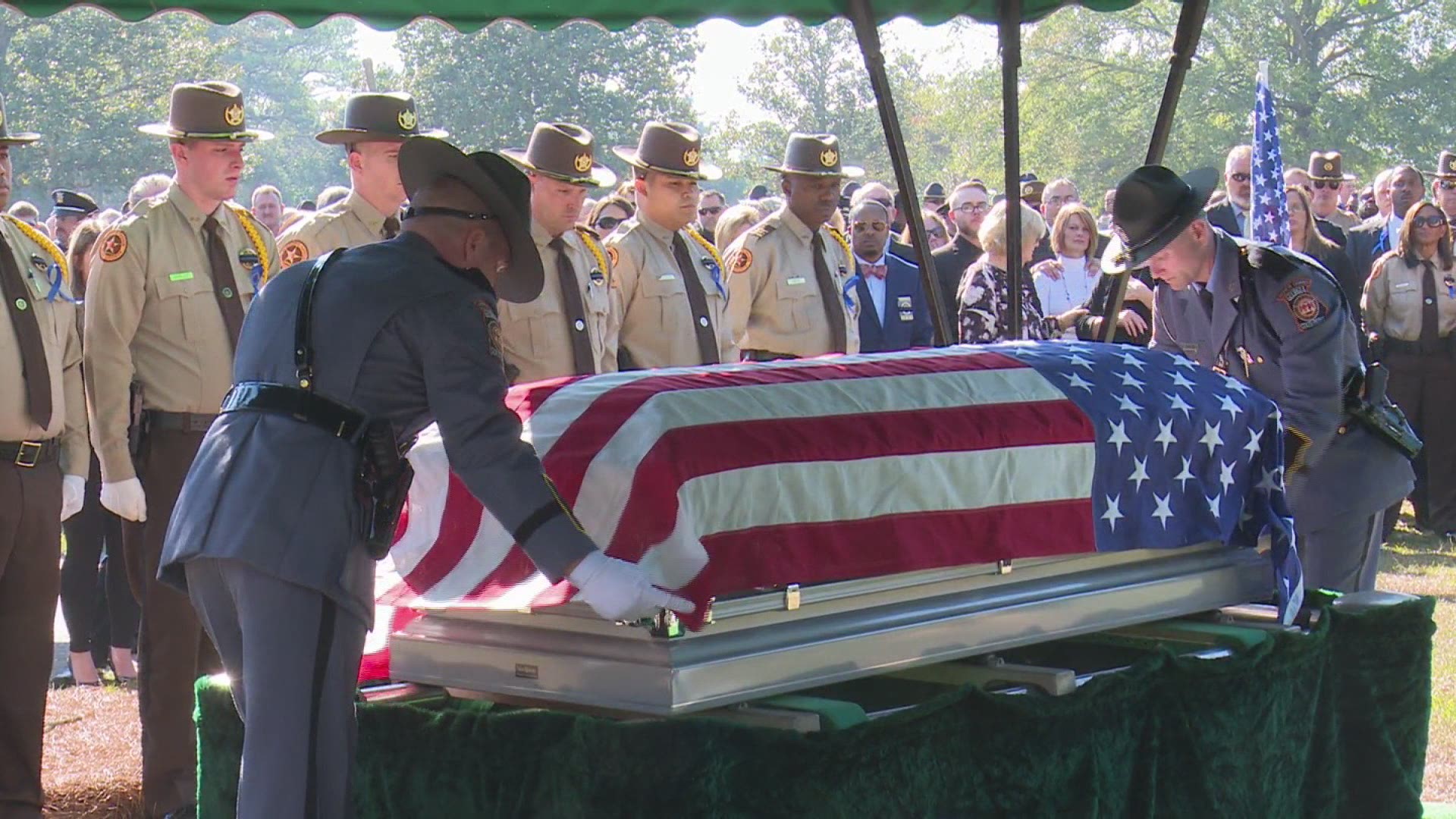 Folding the flag: Guards prepare the flag at Sondron's funeral