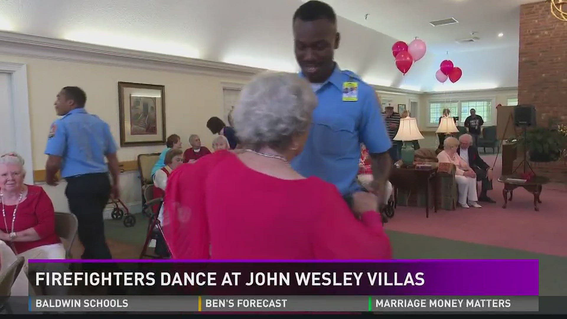 Firefighters dance at John Wesley Villas