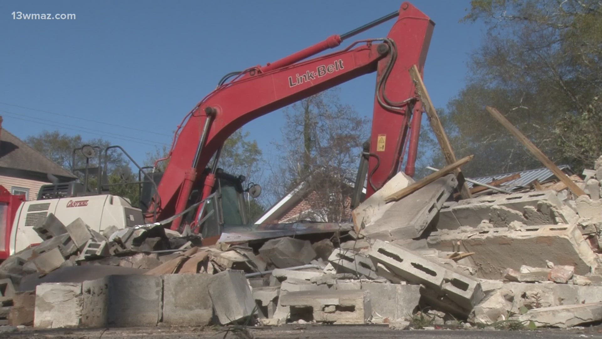 Macon-Bibb City leaders and neighbors from the Vineville and Pleasant Hill watched as the former Bateman and Wade corner grocery was torn down by crews