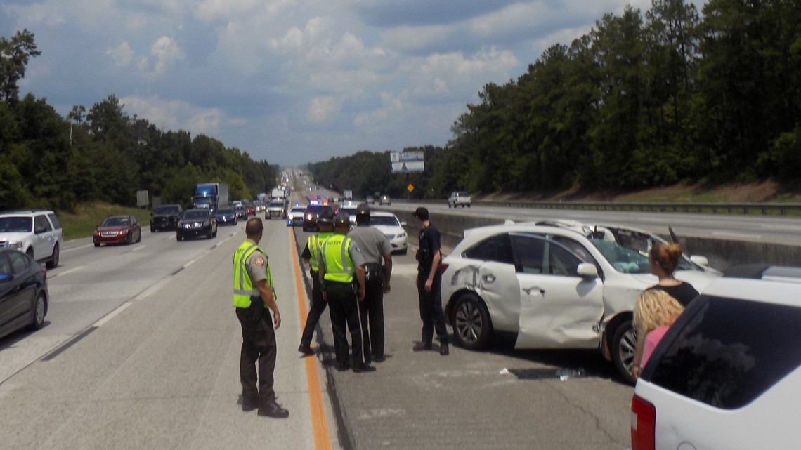 Gray woman killed after loose tire flies off truck, hits car