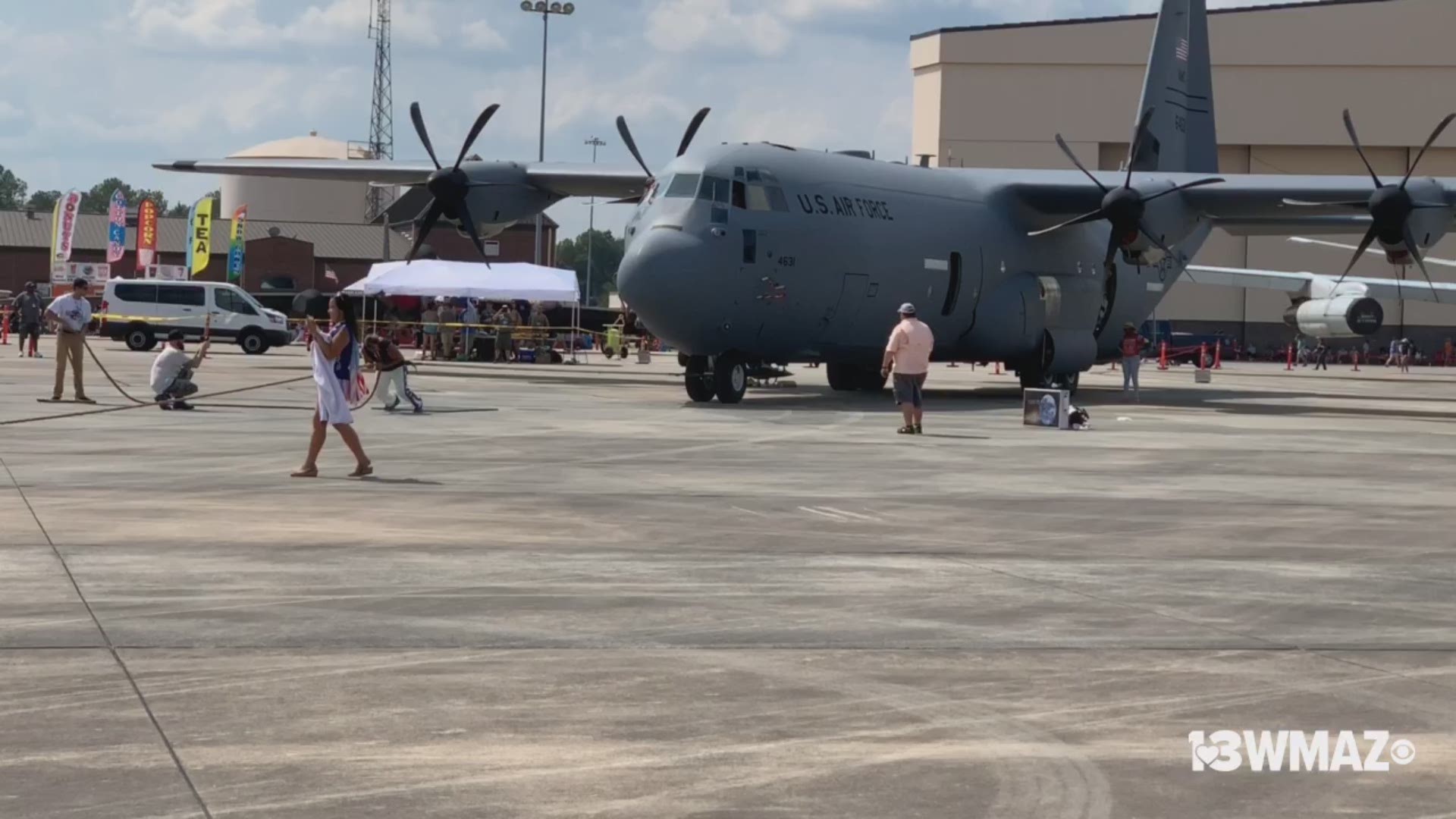 A man pulls a C-130 at the Thunder Over Georgia Air Show.