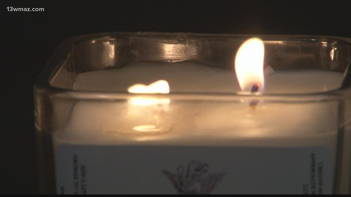 Polish Mercer professor sells candles to raise funds for helping