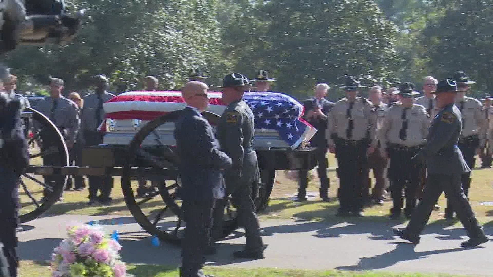 The Caisson carrying fallen Peach County Sheriff's Sgt. Patrick Sondron arrives at Magnolia Park Cemetery.