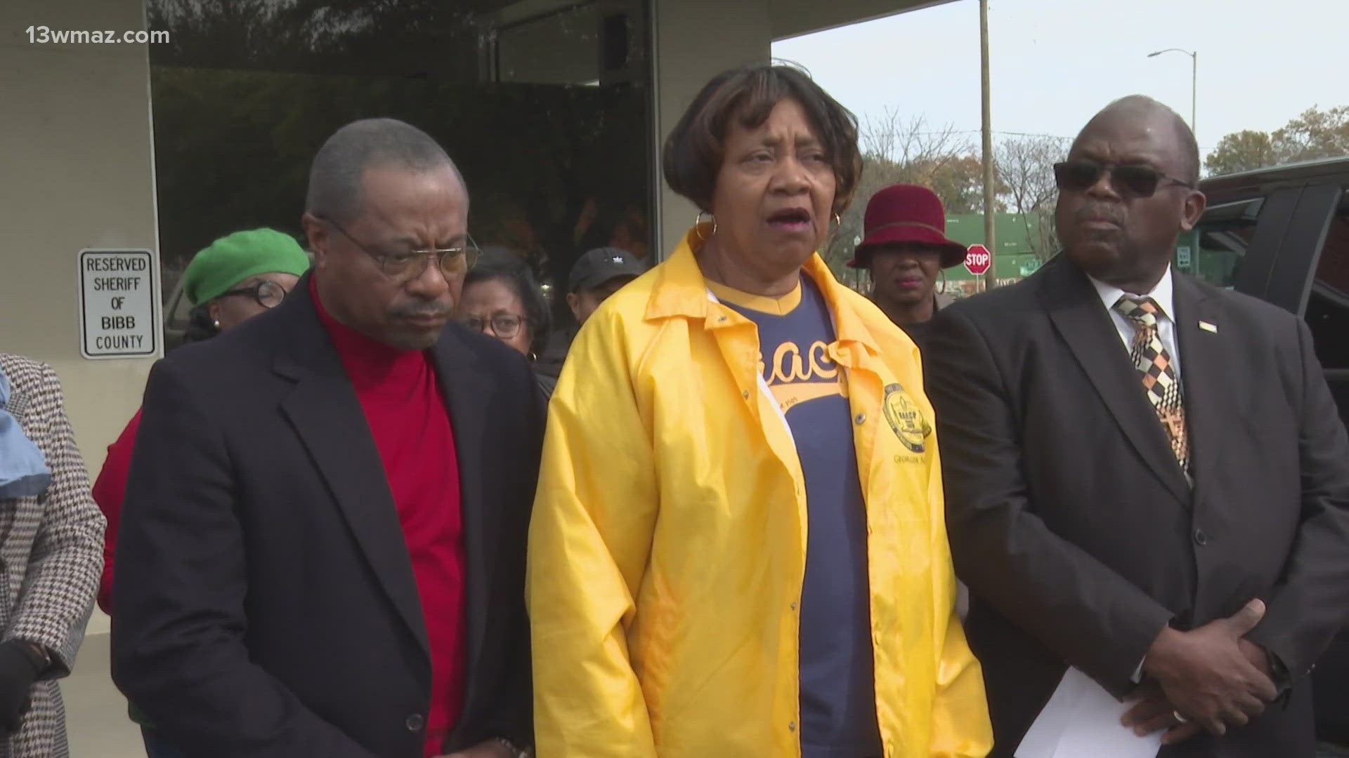 While standing in the parking spots of Sheriff David Davis and his chief deputy, the Macon branch of NAACP criticized the sheriff's office.