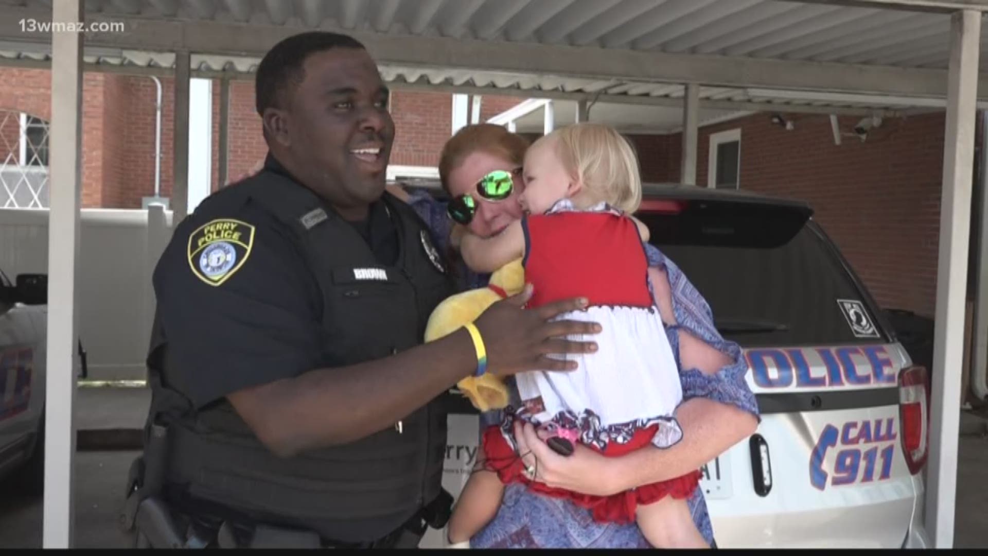 2-year-old Clara Shipes received her newest best friend from Perry Police Officer Josh Brown, who gave it to her at the Perry Independence Day Parade. Now Shipes takes 'Biscuit the Dog' everywhere.