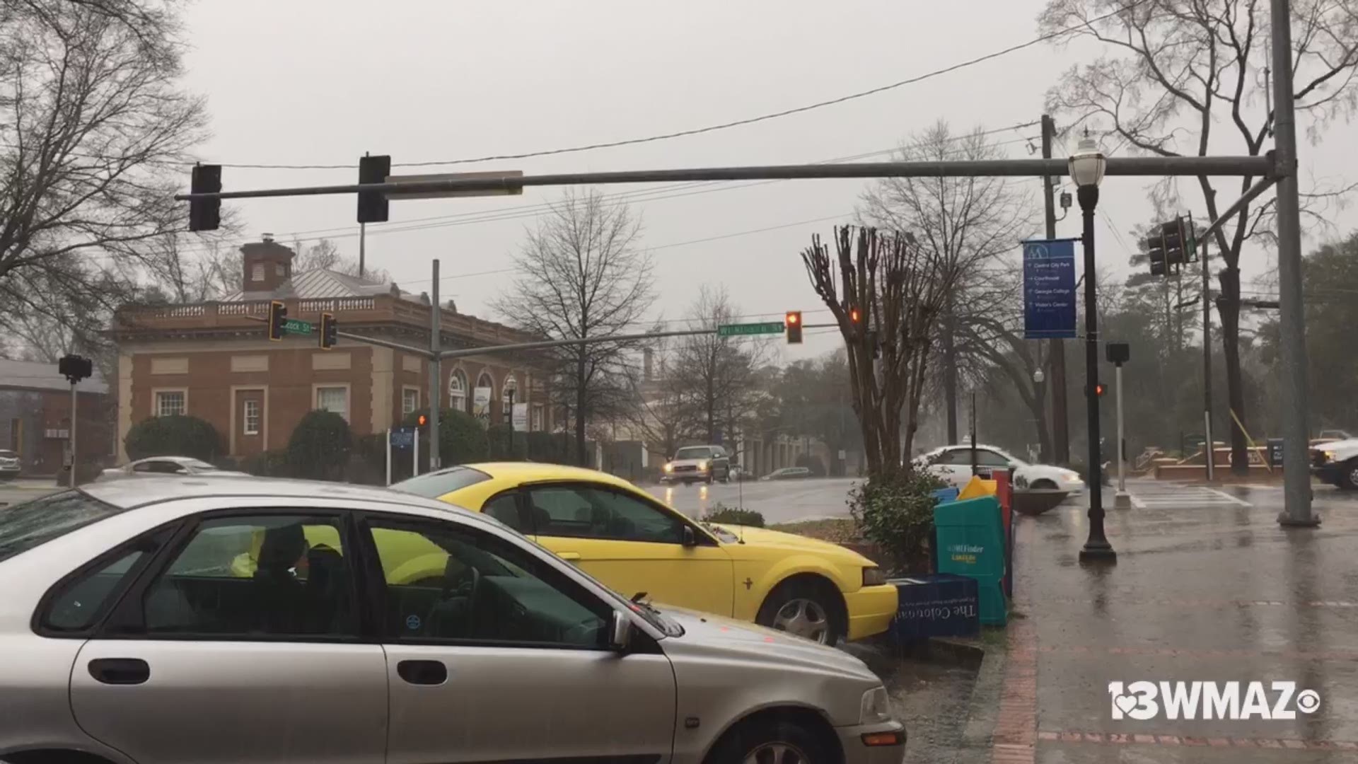 Students were running to class Thursday with broken umbrellas after a sudden downpour in downtown Milledgeville.