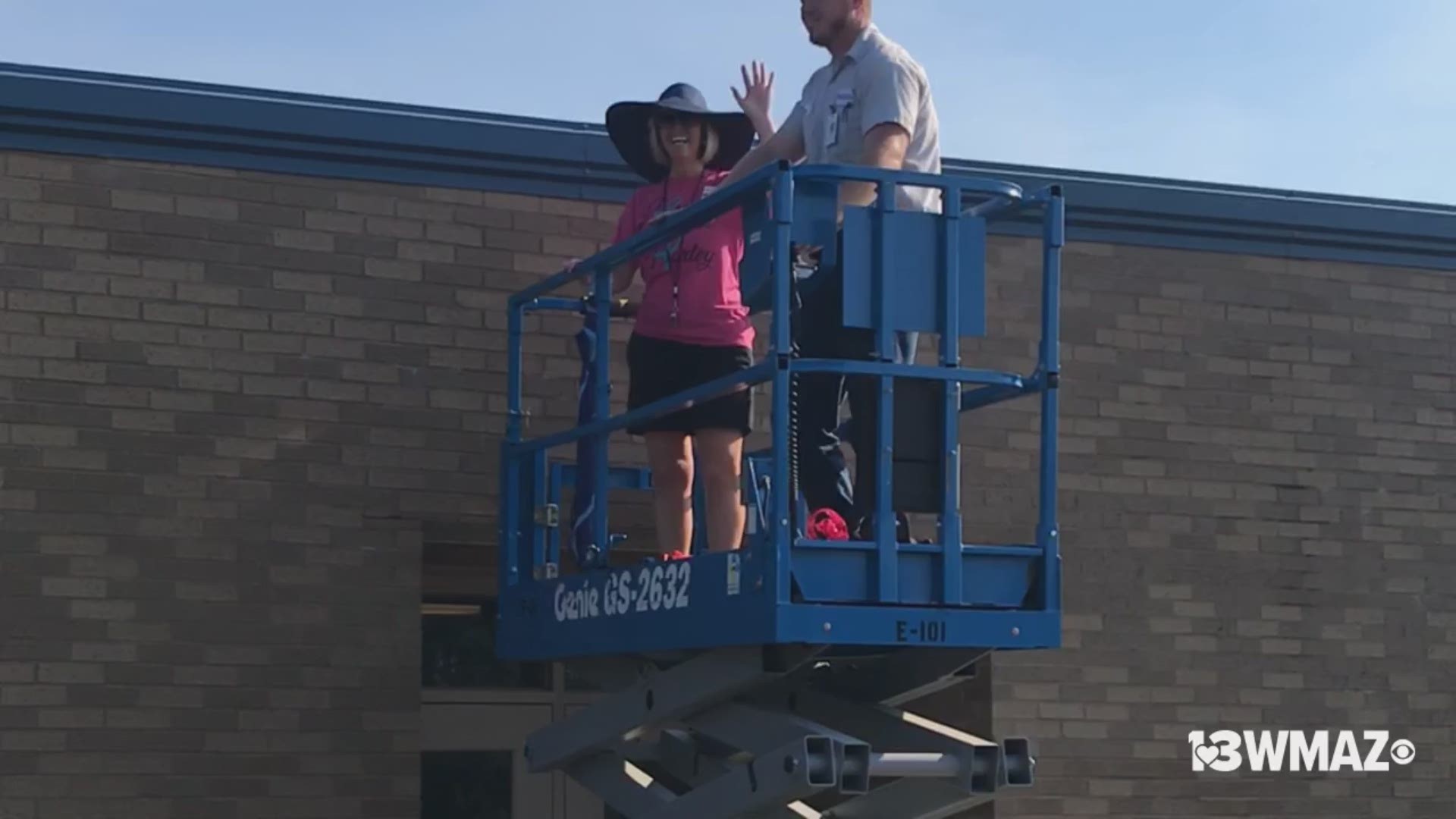 Quail Run principal Cheryl Thomas did her work on the roof Friday and students were able to watch