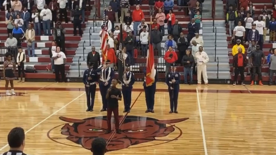 Junior Journalist sings national anthem at Warner Robins basketball