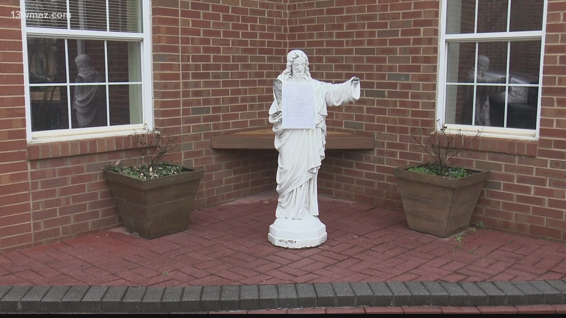Church staff found the statues lying face down with pieces scattered across the sidewalk.