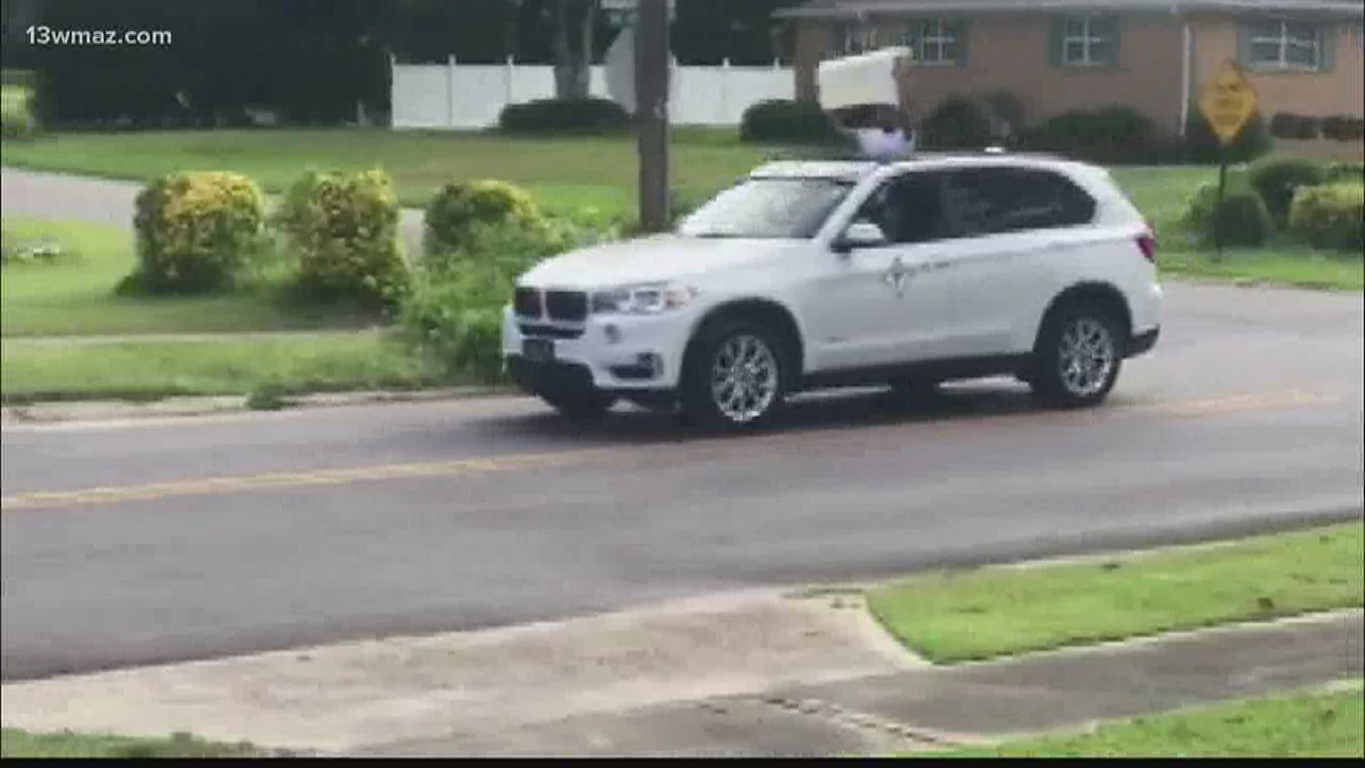 Justin Harris thought he was stepping outside for a walk, but came out to a parade of cars.