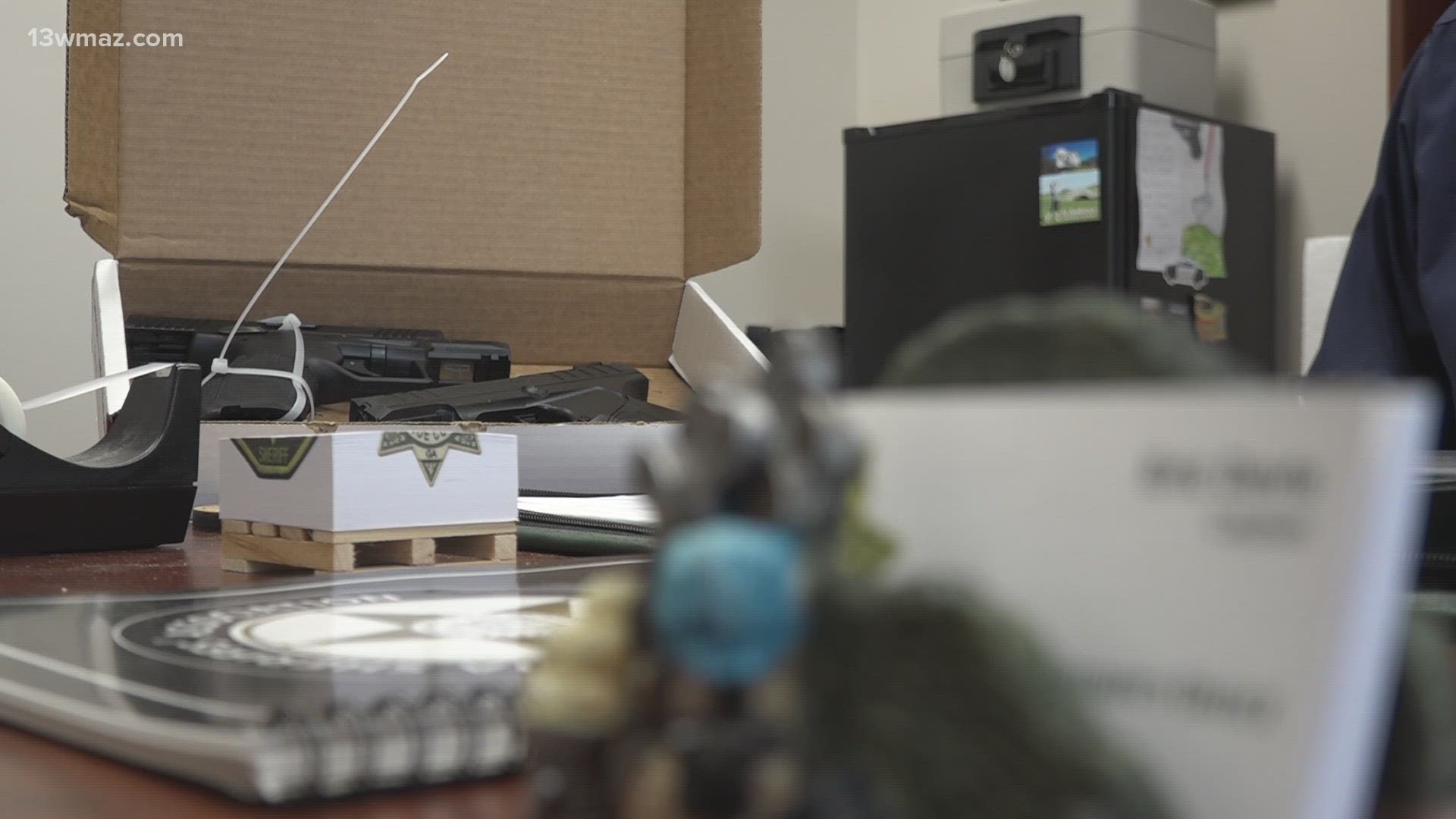 The guns were stored on top of a refrigerator in the garage.