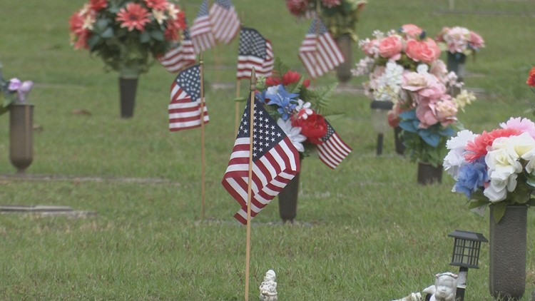 Organizations gather to place flags on veterans graves at Magnolia Park Cemetery