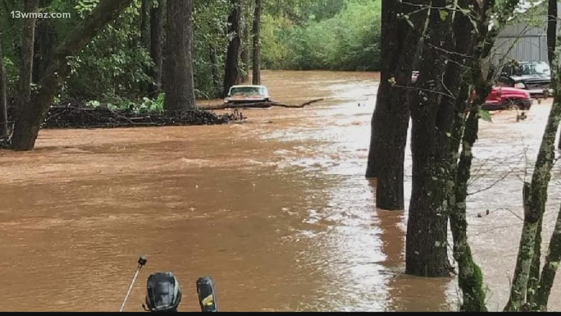 As flash floods ripped across some parts of Central Georgia Thursday, Jones County deputies and a neighbor teamed up to save two people.