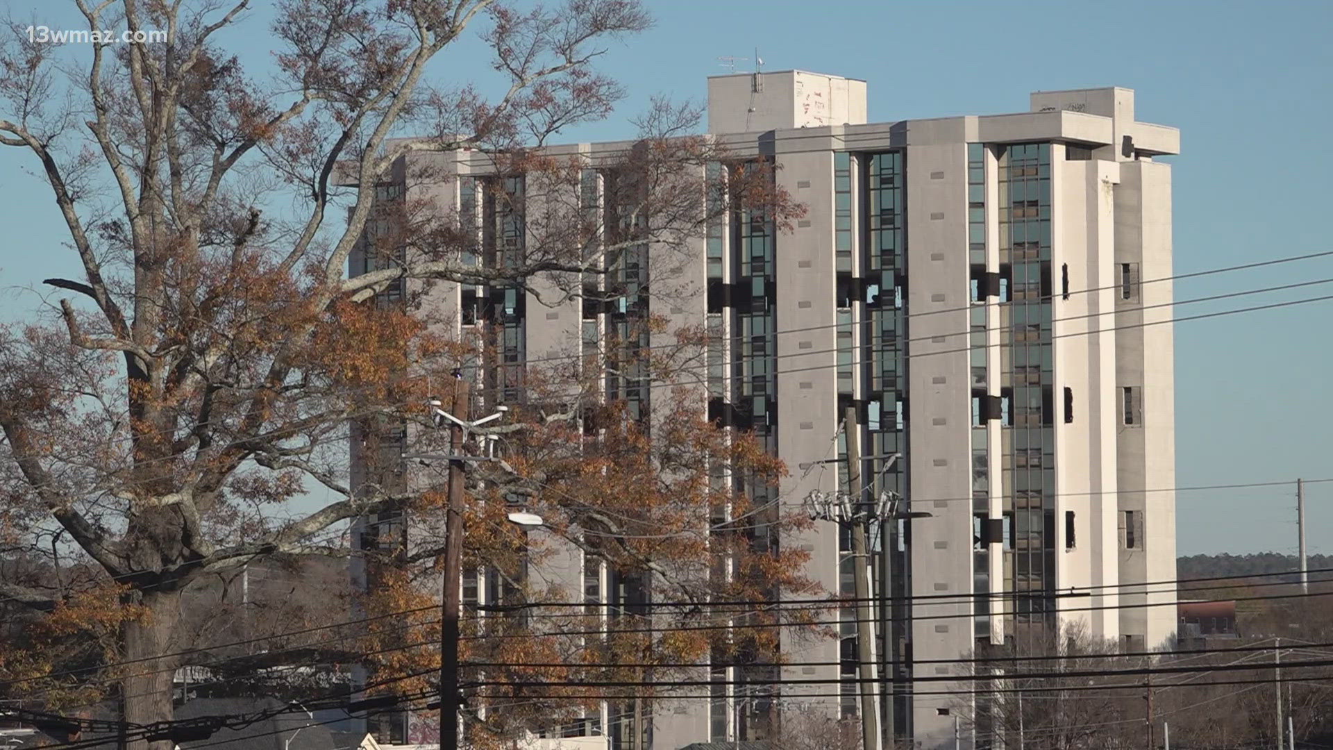 Neighbors right outside of the Old Ramada Hotel's implosion site talk ...