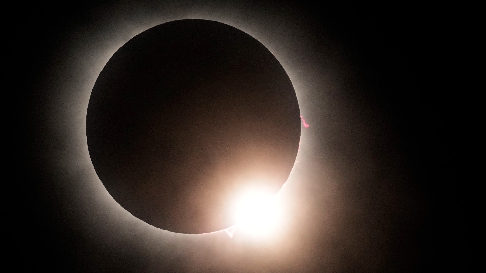 A chilly, midday darkness fell across North America on Monday as a total solar eclipse raced across the continent
