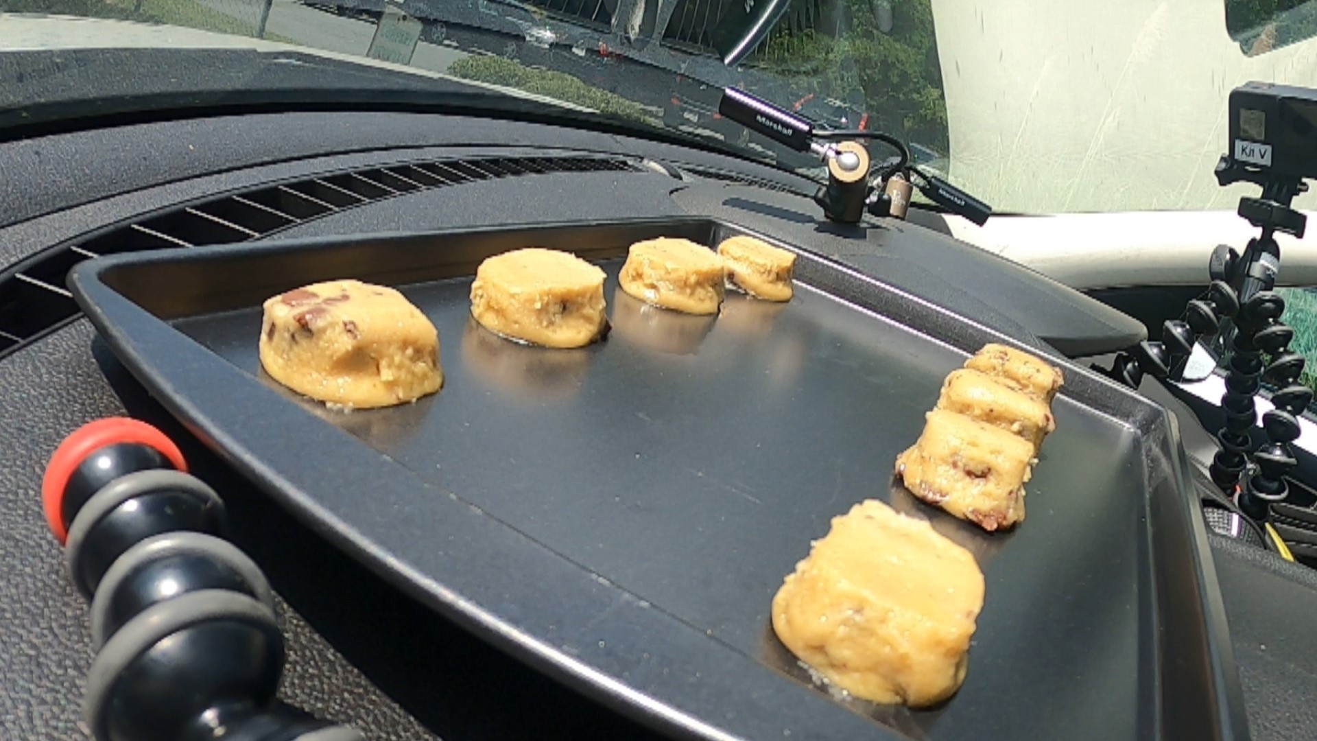 Meteorologist Jordan West bakes cookies on the Storm Lab's dashboard.