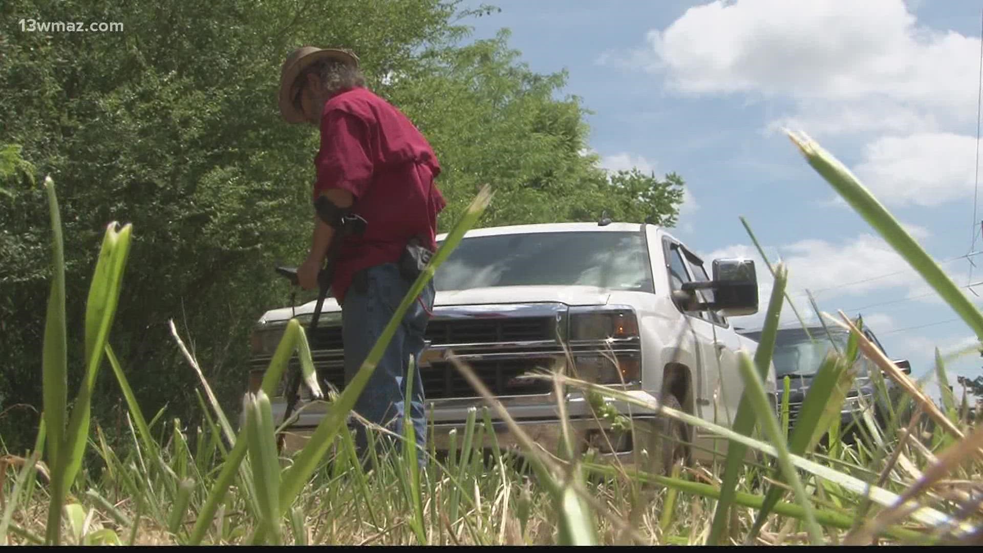 The group's leader says 2,000 graves could be hidden beneath the brush.