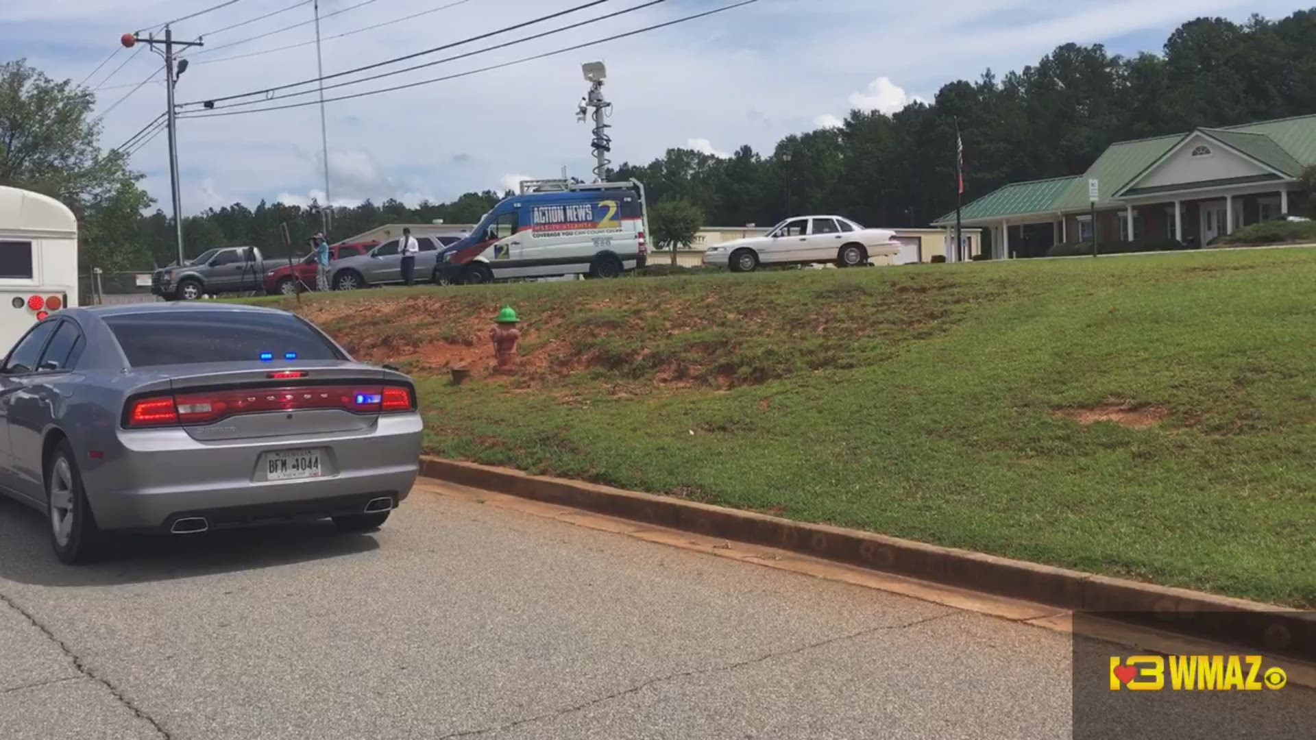 A bus of prisoners arriving at the Putnam County Sheriff's Office following a fatal escape Tuesday morning in which two corrections officers were killed.