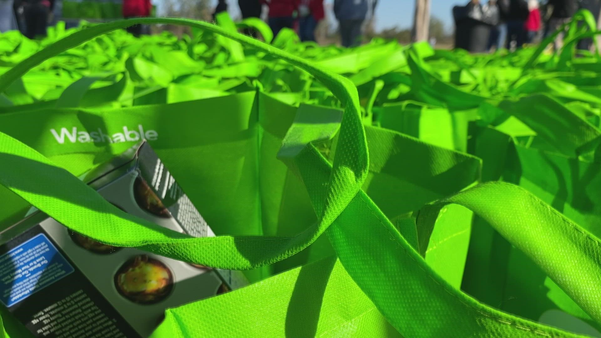 Volunteers need to help distribute food in cars to families in need.