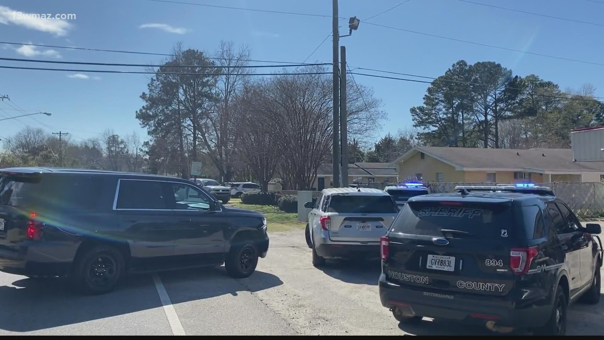 The sheriff's office says deputies never opened fire during the standoff, and the gunshot they heard came from inside the victim's apartment.