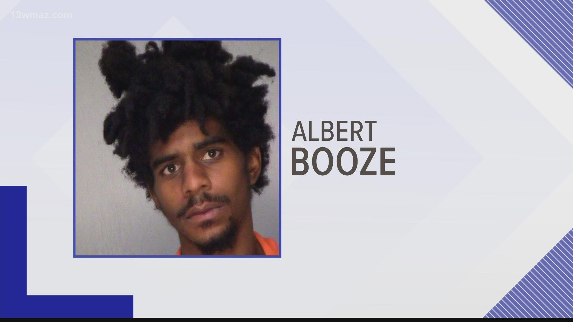 Albert Booze is accused of murdering a Bibb County officer and assaulting Monroe County officers in jail