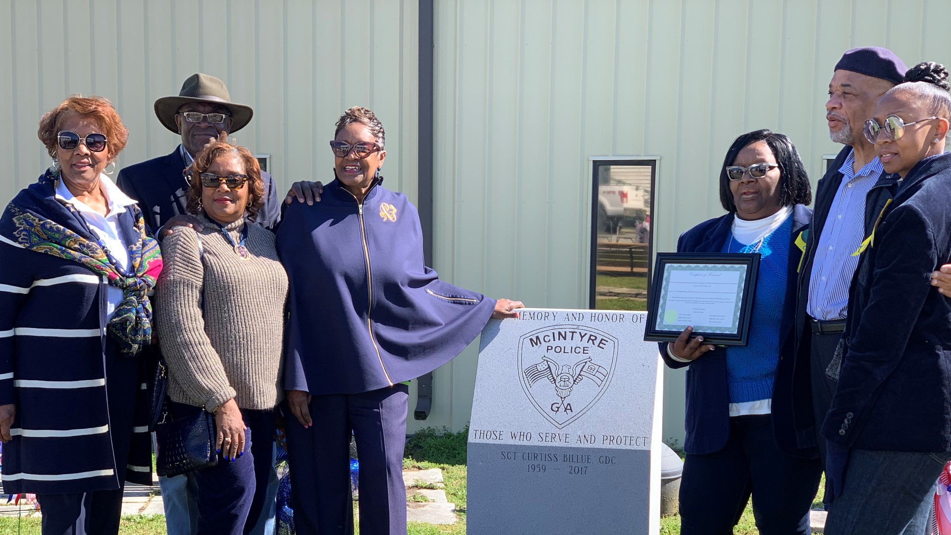 The city of McIntyre honored fallen Georgia Corrections officer Curtis Billue with a special marker. It reads "In memory and honor of those who serve and protect."